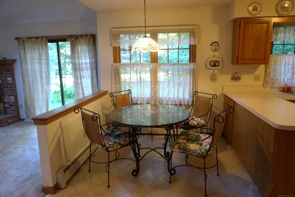 a dining room with furniture and window