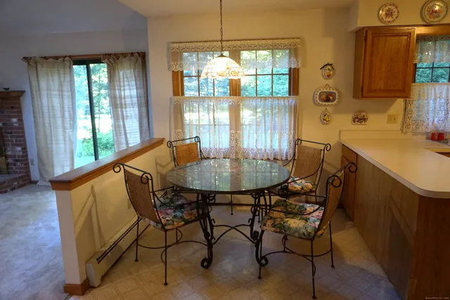 a dining room with furniture and window