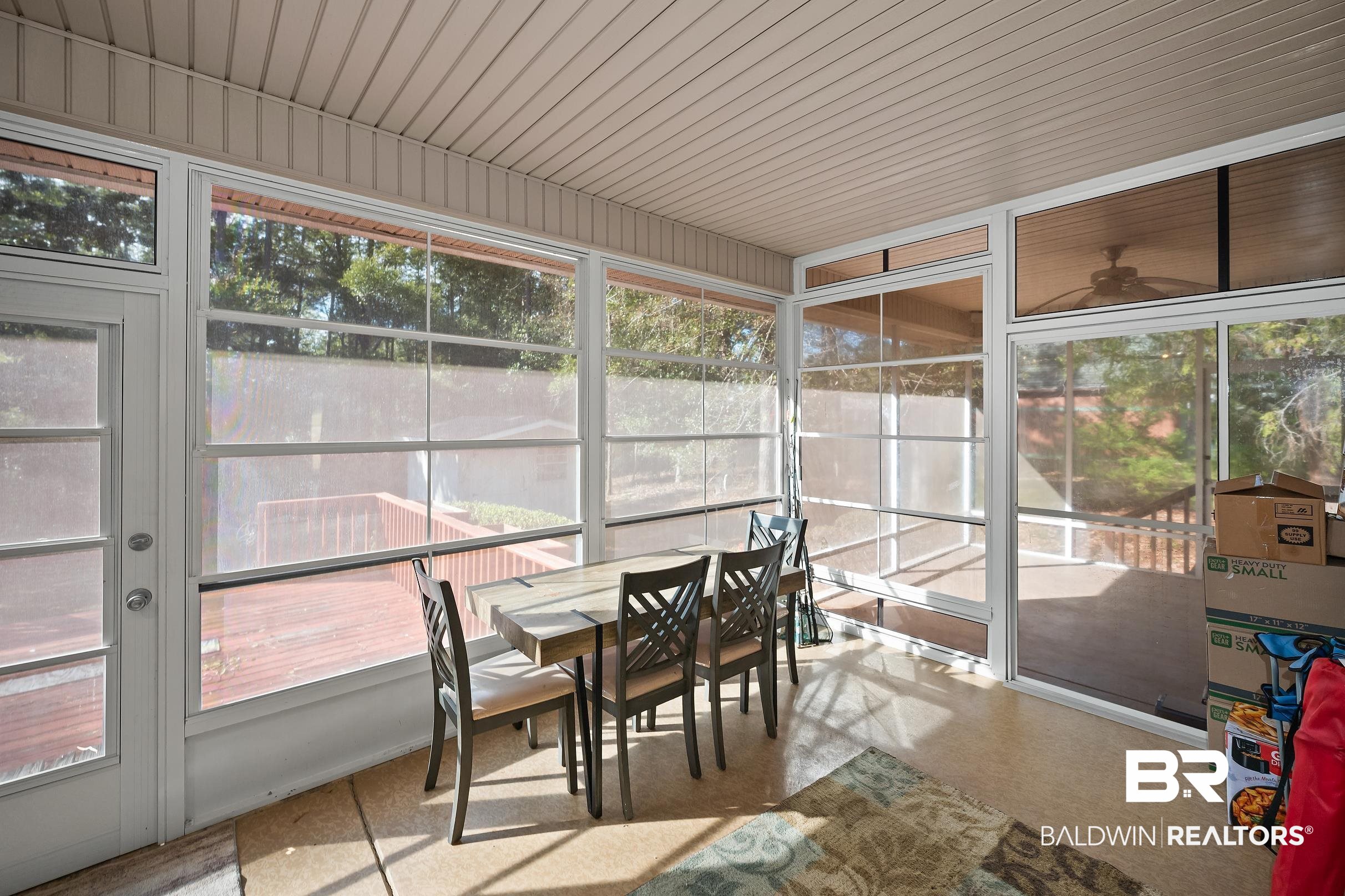2674 Pine Ridge Drive Lillian, AL 36549 - Photo 22 of 42 Sunroom with outdoor dining space