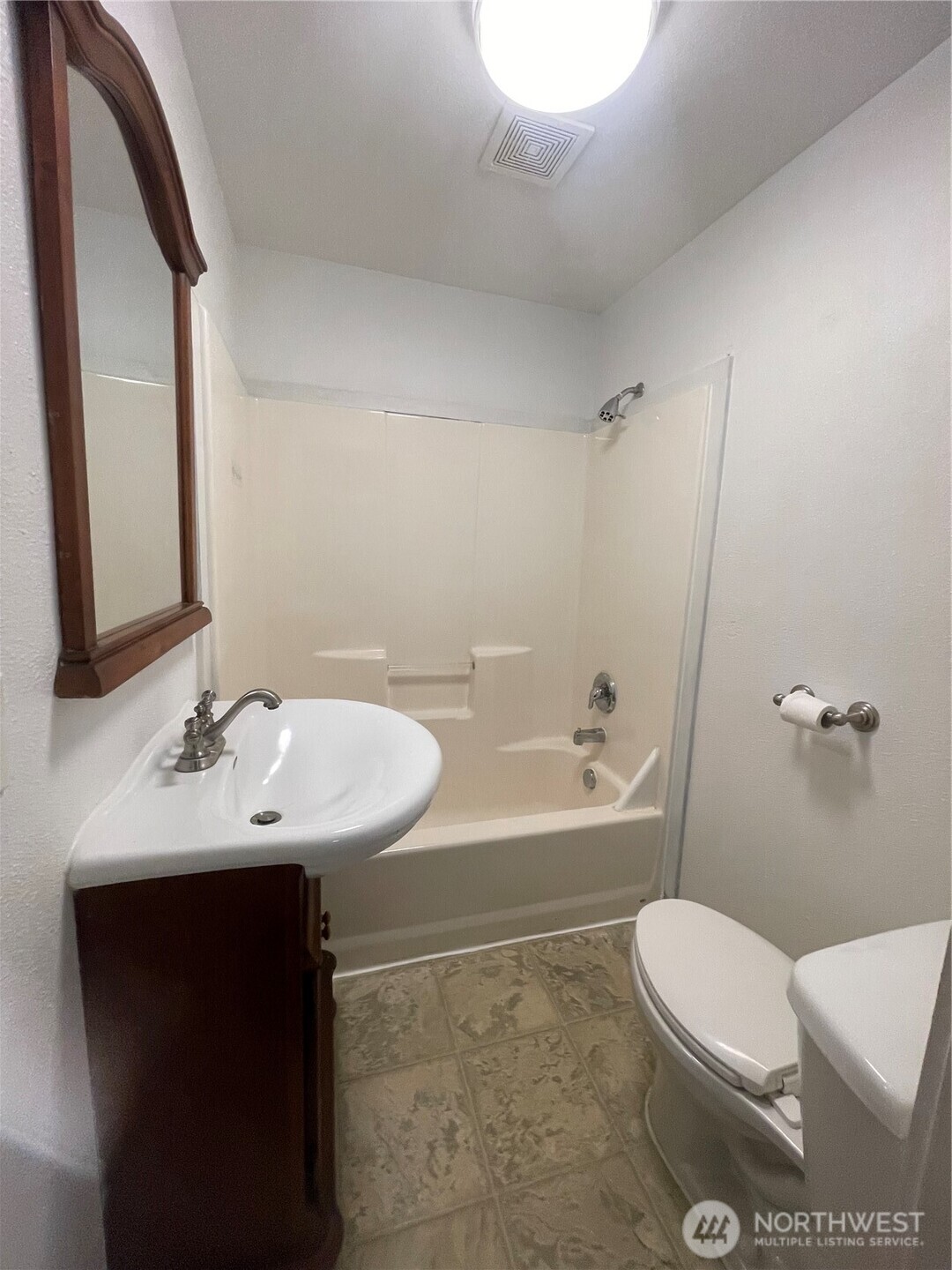 903 Howard Street Raymond, WA 98577 - Photo 7 of 11 a bathroom with a sink a toilet and shower
