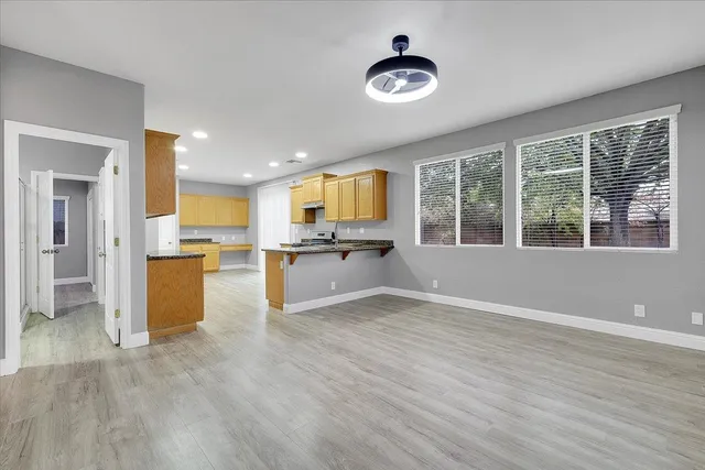 a view of kitchen with wooden floor and window