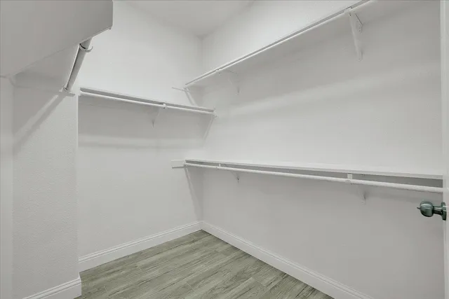 a view of an empty walk in closet