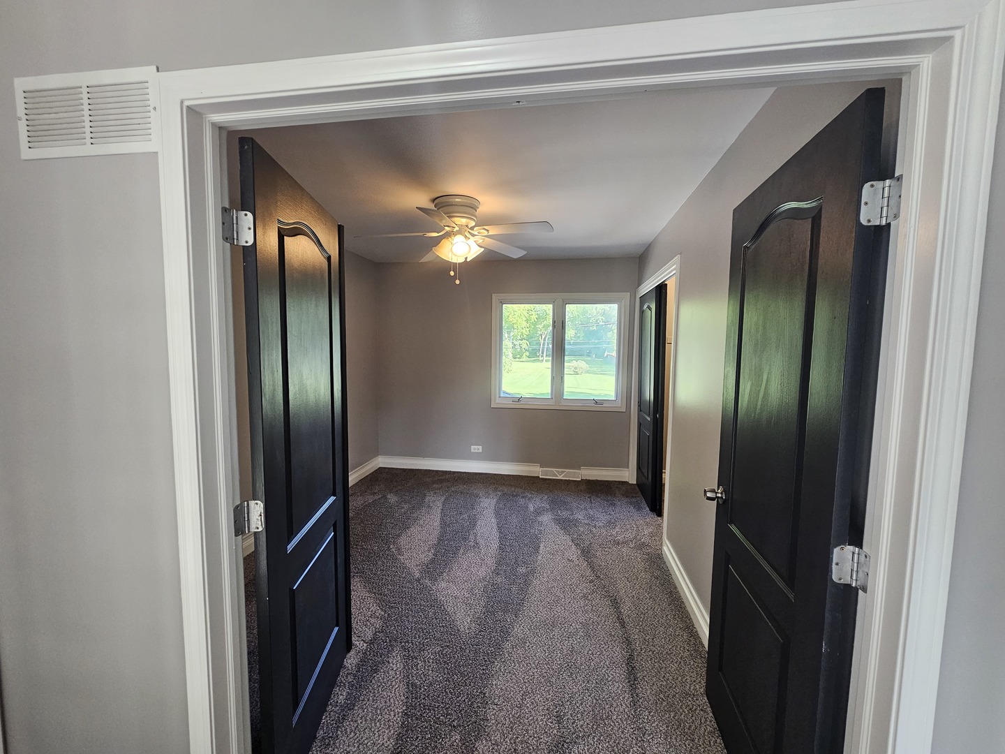 1821 Terrace Road Homewood, IL 60430 - Photo 7 of 9 a view of an empty room with a fireplace and a window