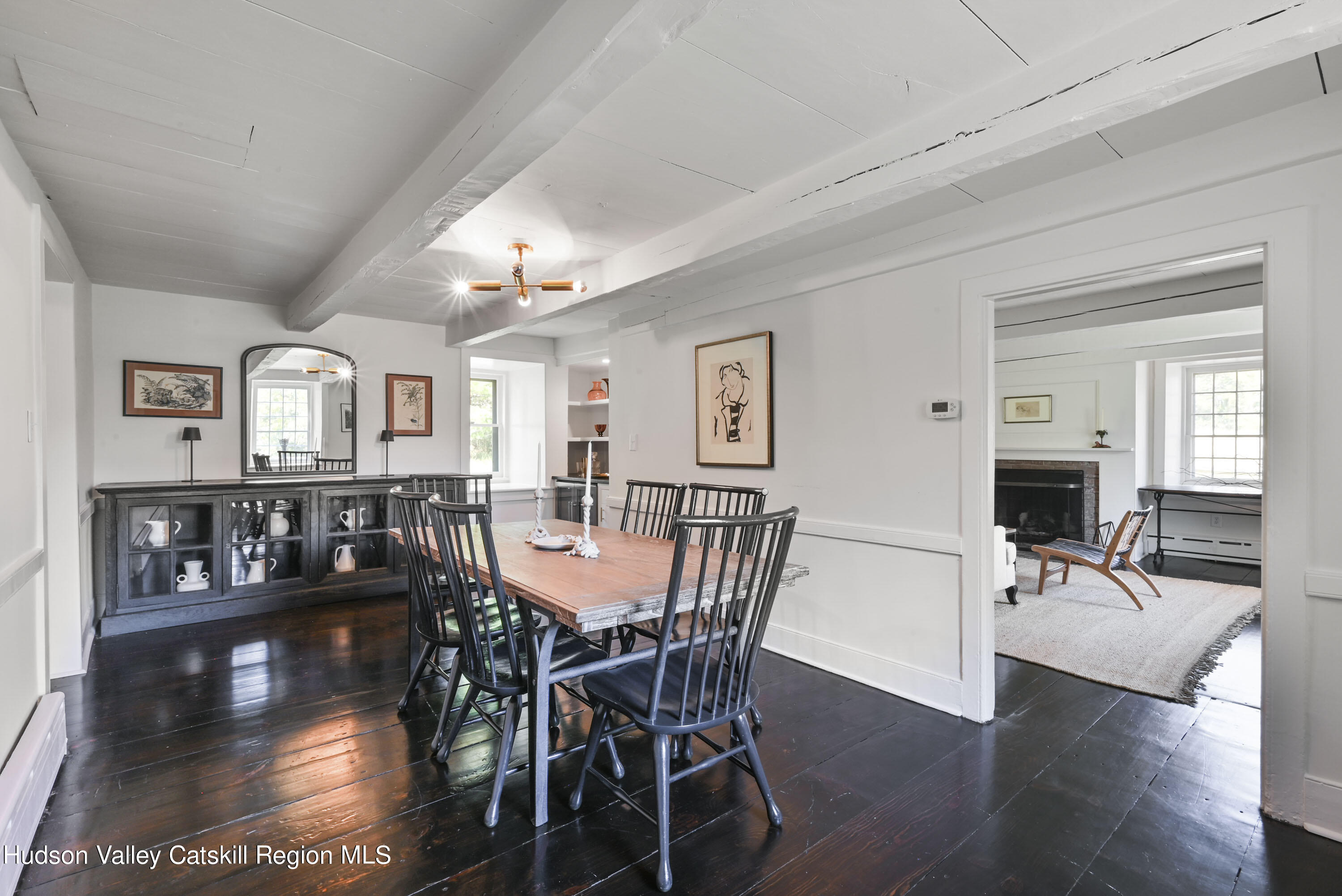351 Peak Road Stone Ridge, NY 12484 - Photo 16 of 32 a view of a dining room with furniture window and wooden floor