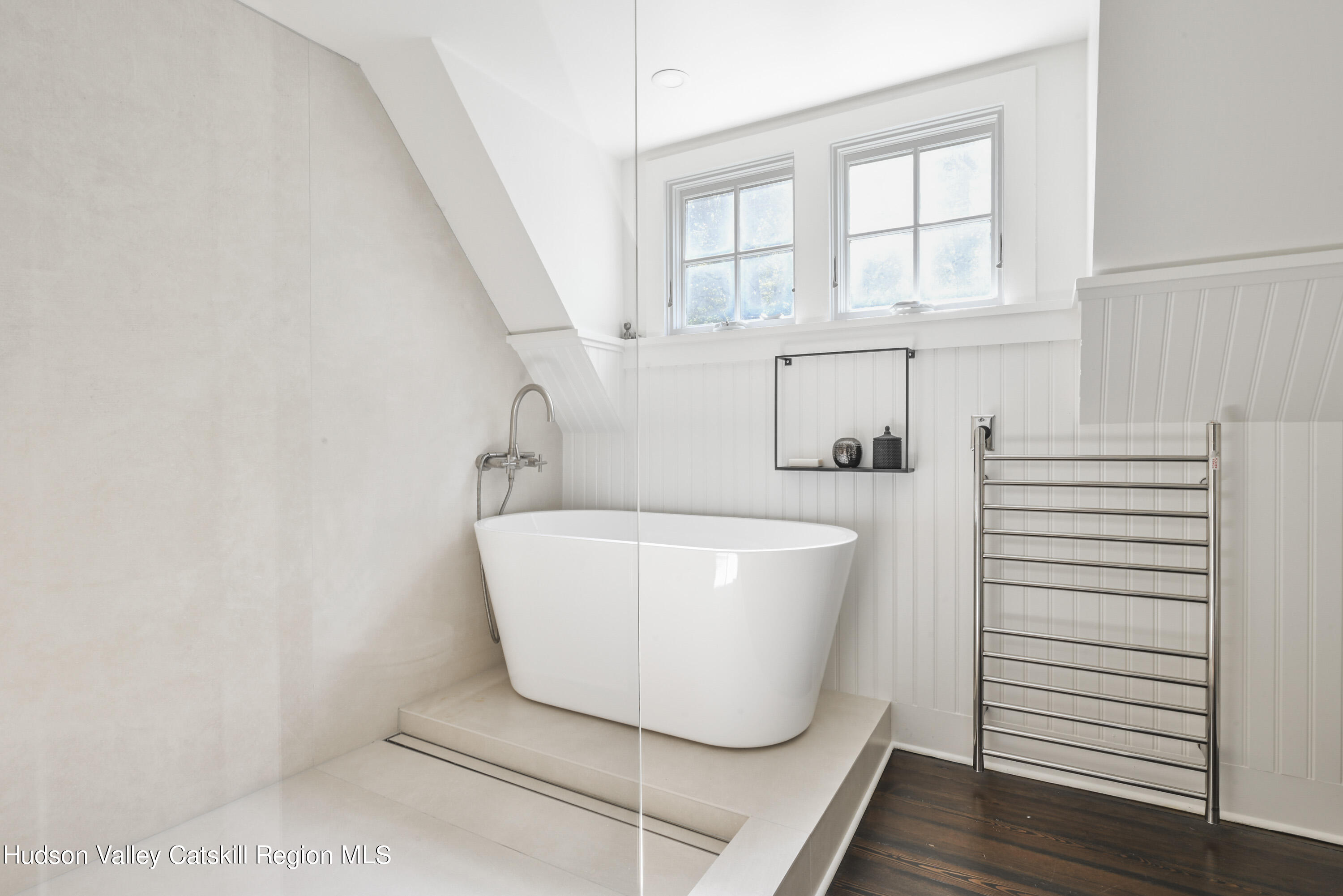 351 Peak Road Stone Ridge, NY 12484 - Photo 23 of 32 a white bath tub sitting in a bathroom next to a window