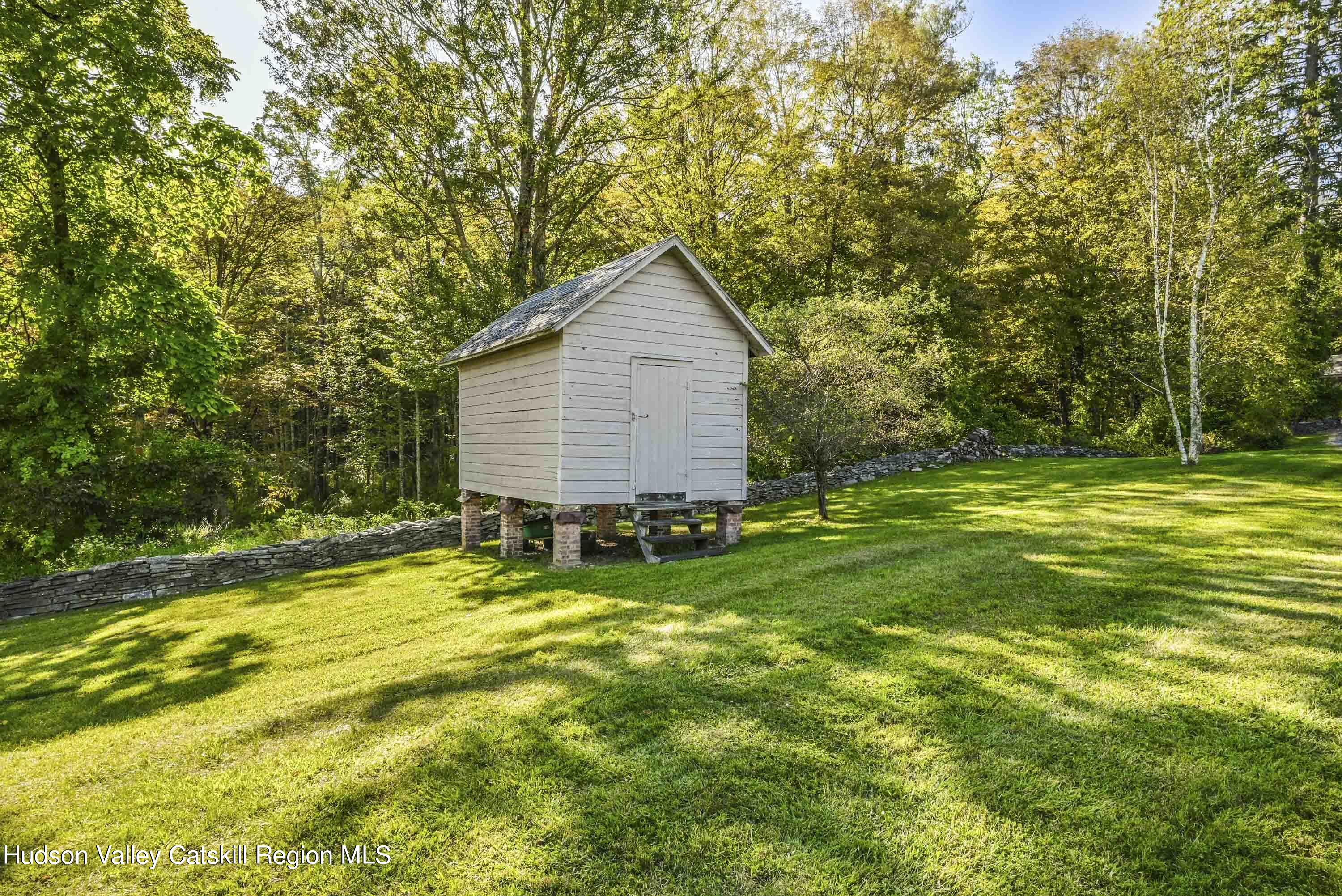 351 Peak Road Stone Ridge, NY 12484 - Photo 29 of 32 a view of a house with a yard and sitting area