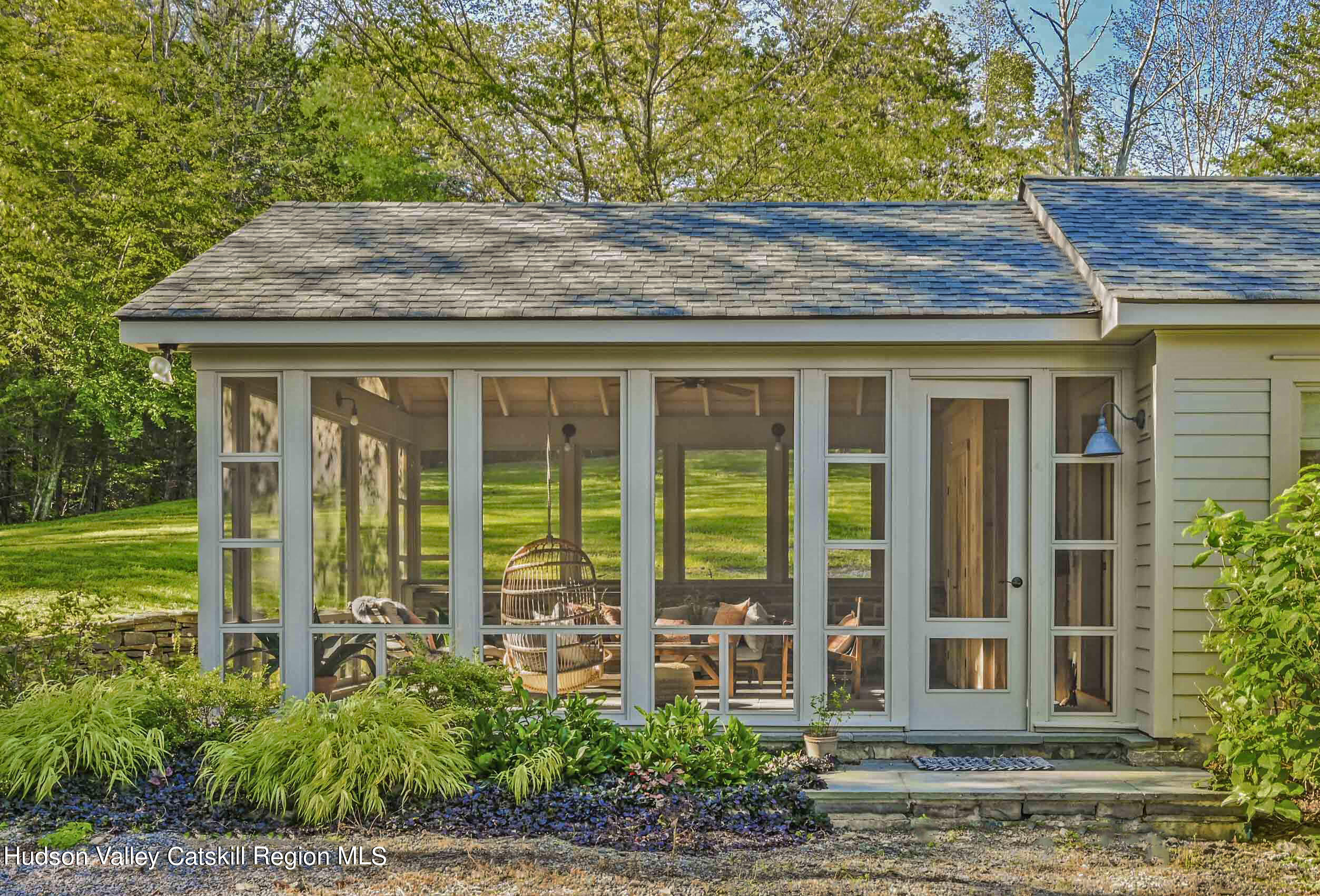 351 Peak Road Stone Ridge, NY 12484 - Photo 3 of 32 a front view of a house with garden