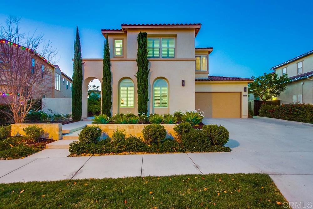 7177 Sitio Corazon Carlsbad, CA 92009 - Photo 1 of 41 a front view of a house with a yard