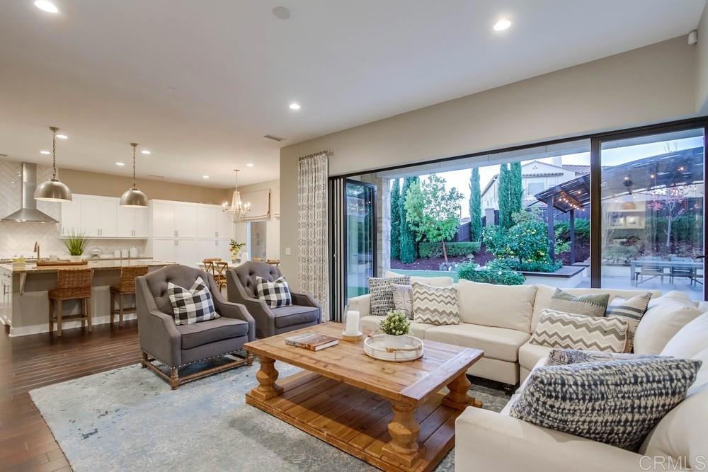7177 Sitio Corazon Carlsbad, CA 92009 - Photo 18 of 41 a living room with furniture and a large window