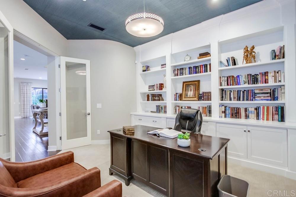 7177 Sitio Corazon Carlsbad, CA 92009 - Photo 21 of 41 a room with furniture and a book shelf