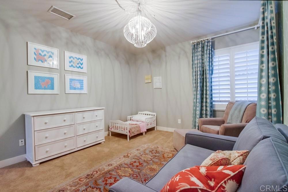 7177 Sitio Corazon Carlsbad, CA 92009 - Photo 34 of 41 a bedroom with furniture and a large window