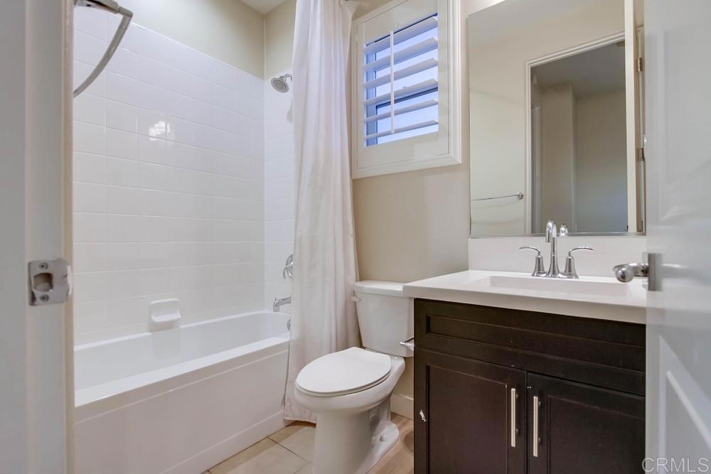 7177 Sitio Corazon Carlsbad, CA 92009 - Photo 35 of 41 a bathroom with a sink a toilet and a bathtub