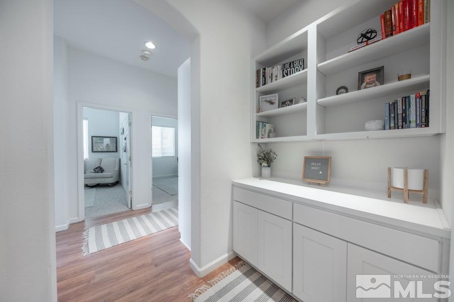 10529 Eagle Falls Way Reno, NV 89521 - Photo 16 of 24 a hallway with cabinets and wooden floor
