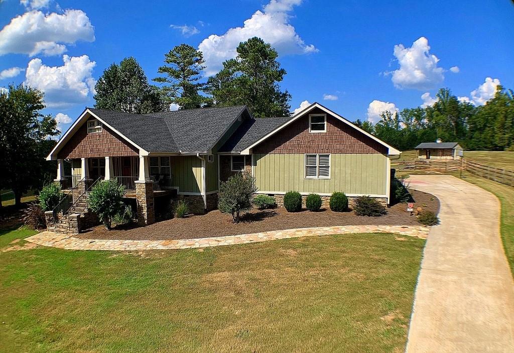 61 Harris Loop Dallas, GA 30157 - Photo 1 of 1 Custom Equestrian Ranch Estate on 3.0 Acres! Amazing Space Inside and Outside! Front Porch Living w/Screened Back Porch Overlooking Two Stable Horse Barn and Pasture w/ Access to the Silver Commit Trail