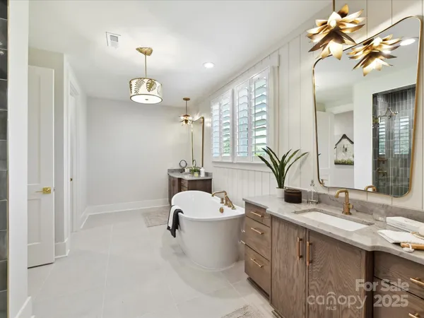 a bathroom with a double vanity sink and a mirror