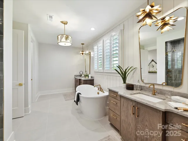 a bathroom with a double vanity sink and a mirror