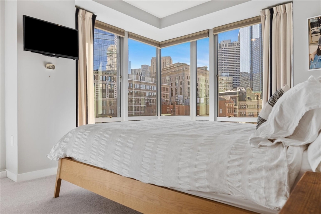 80 Broad Street, Unit 808 Boston, MA 02110 - Photo 14 of 27 a view of a bedroom with a large window