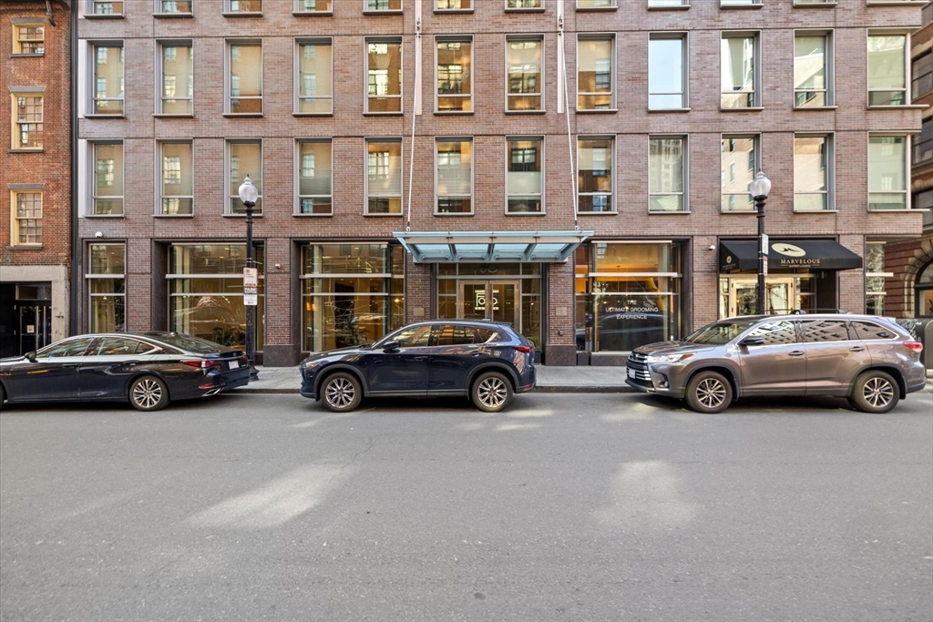 80 Broad Street, Unit 808 Boston, MA 02110 - Photo 23 of 27 a view of a cars parked in front of a building