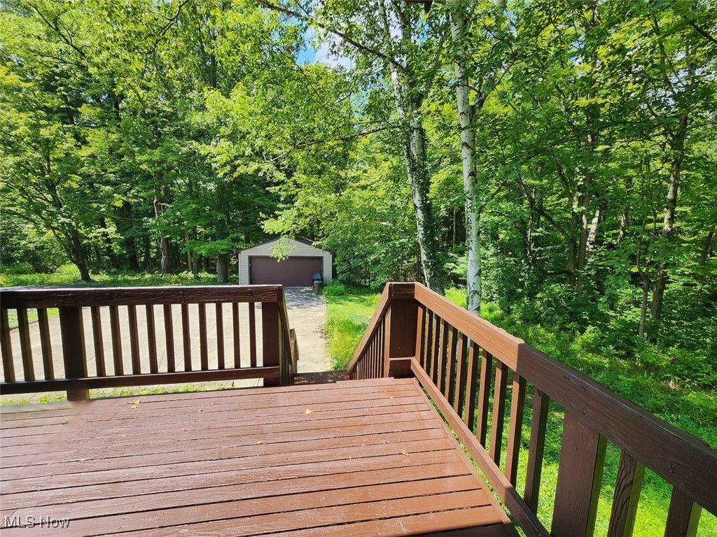 2917 West Bath Road Akron, OH 44333 - Photo 10 of 22 Wooden terrace featuring an outbuilding and a detached garage