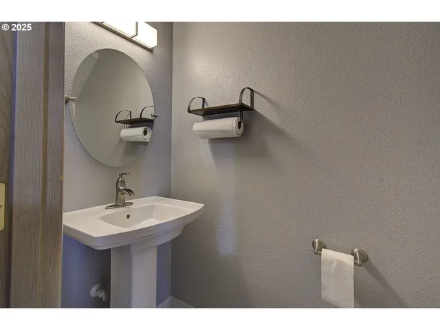 a bathroom with a sink and mirror
