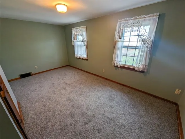 a view of staircase with wooden floor and stairs