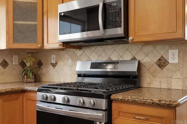 a kitchen with a refrigerator and a sink