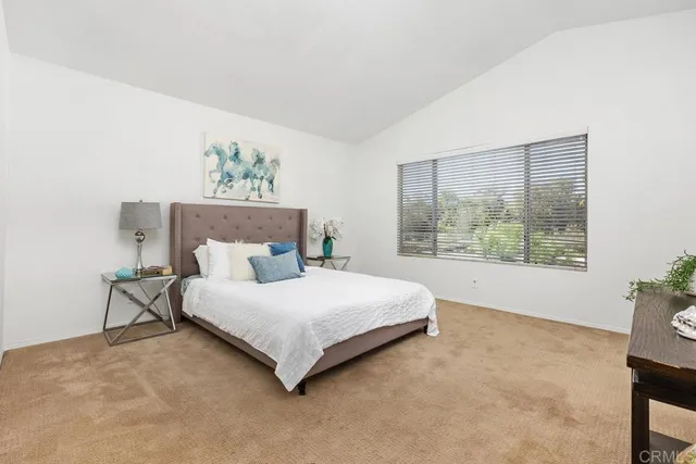 a bathroom with a granite countertop sink mirror and bathtub