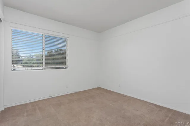 a sink with white cabinets and sink