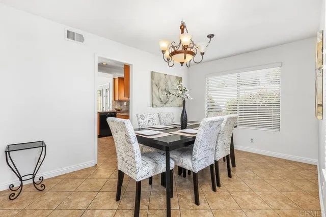 a living room with furniture large window and a fireplace