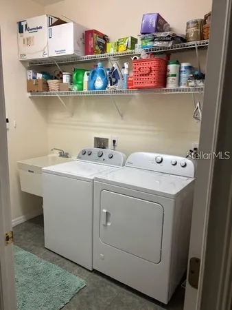 a utility room with dryer and washer