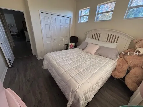 a bedroom with a bed and a mirror
