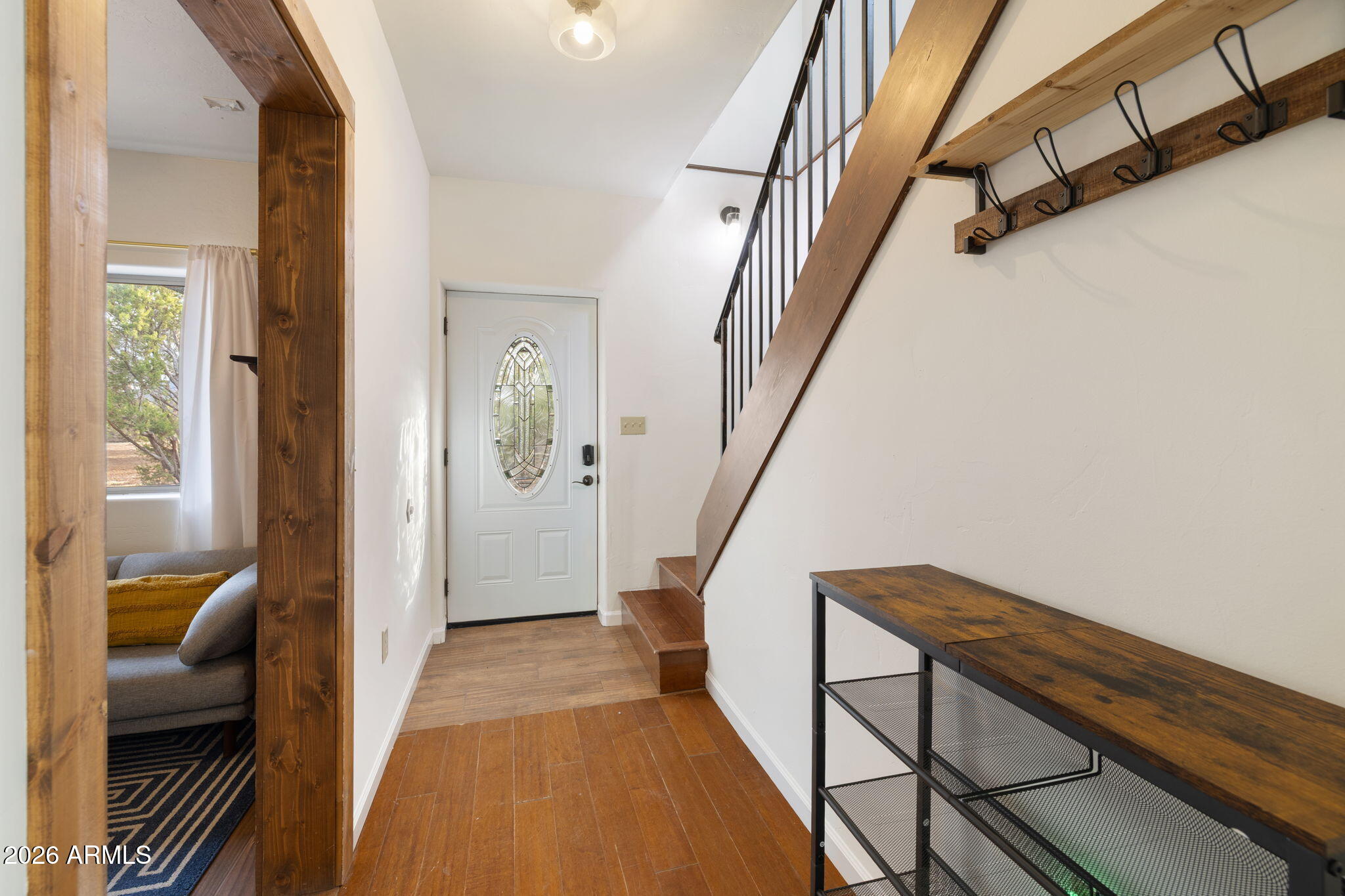 9042 North Red Fox Lane Williams, AZ 86046 - Photo 13 of 56 a view of a hallway with furniture and stairs