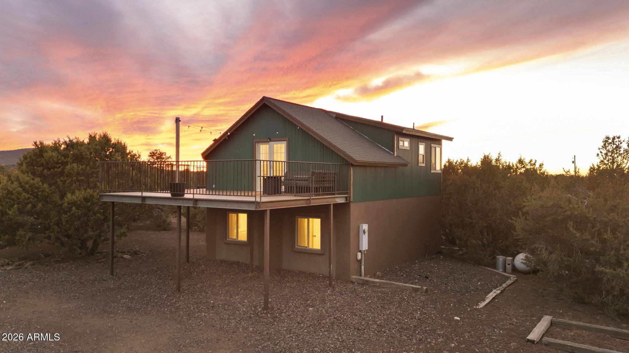 9042 North Red Fox Lane Williams, AZ 86046 - Photo 2 of 56 a view of a house with roof deck