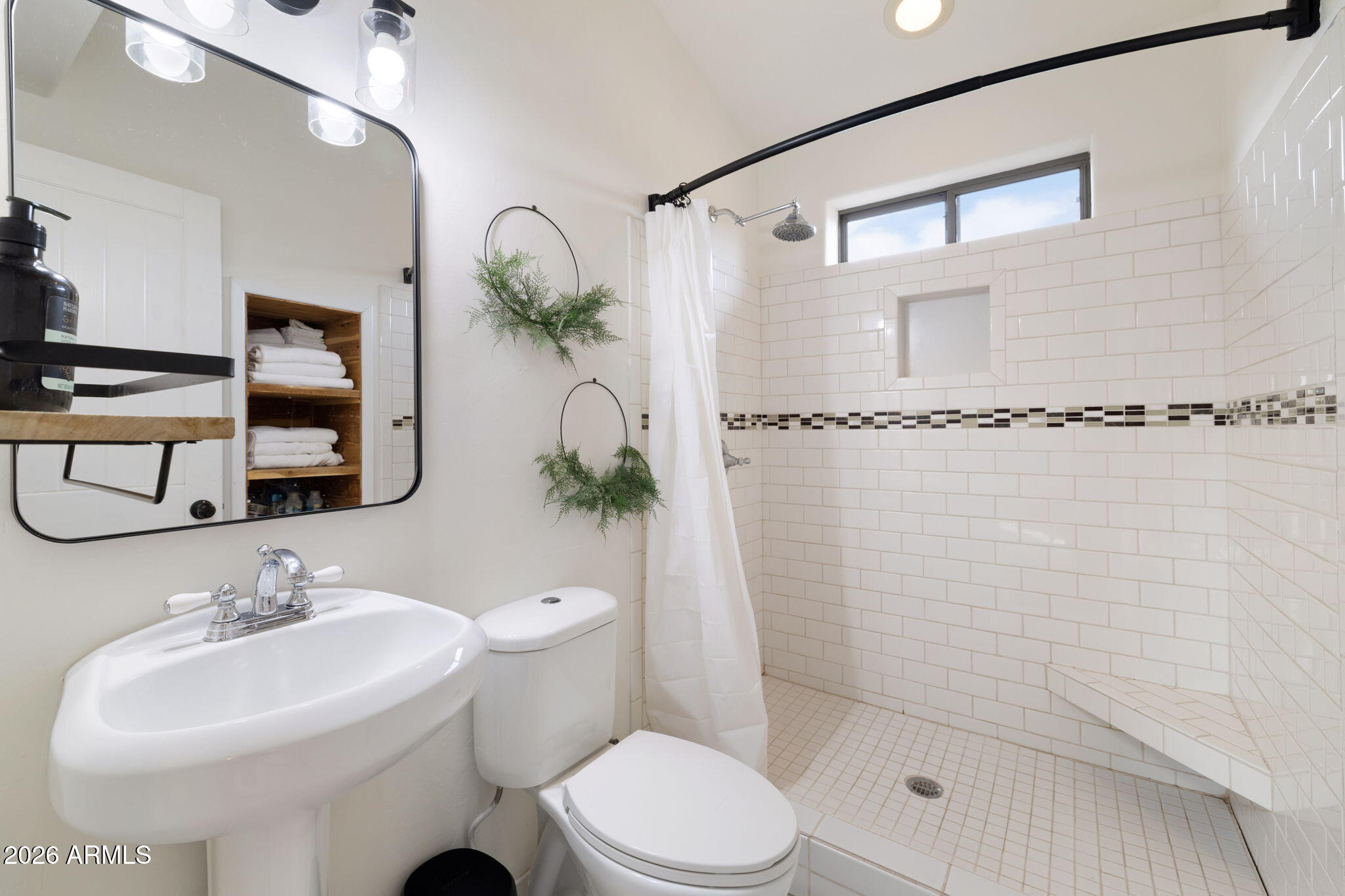 9042 North Red Fox Lane Williams, AZ 86046 - Photo 34 of 56 a bathroom with a sink toilet and shower