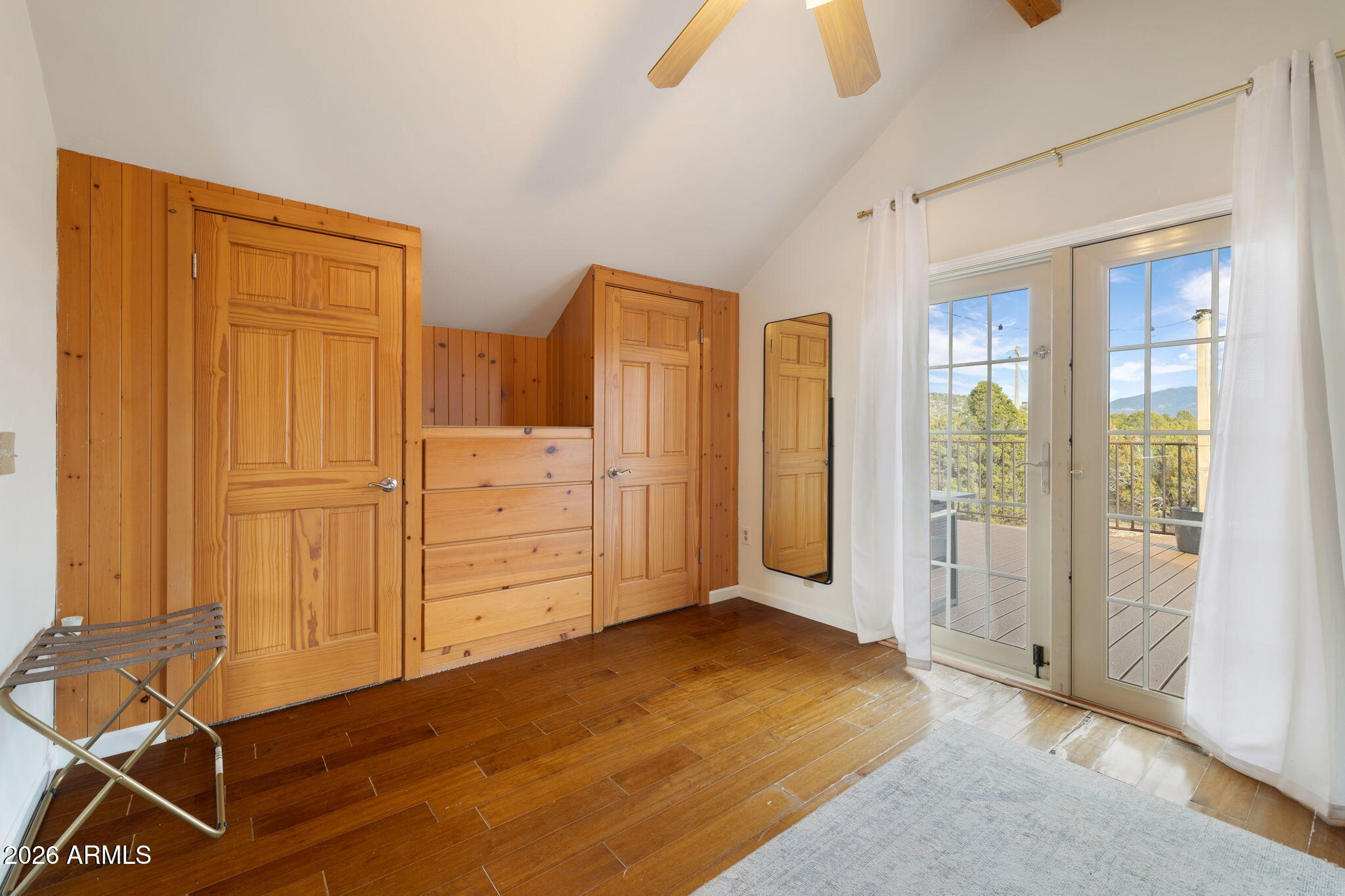 9042 North Red Fox Lane Williams, AZ 86046 - Photo 37 of 56 a view of a room with wooden floor closet and windows