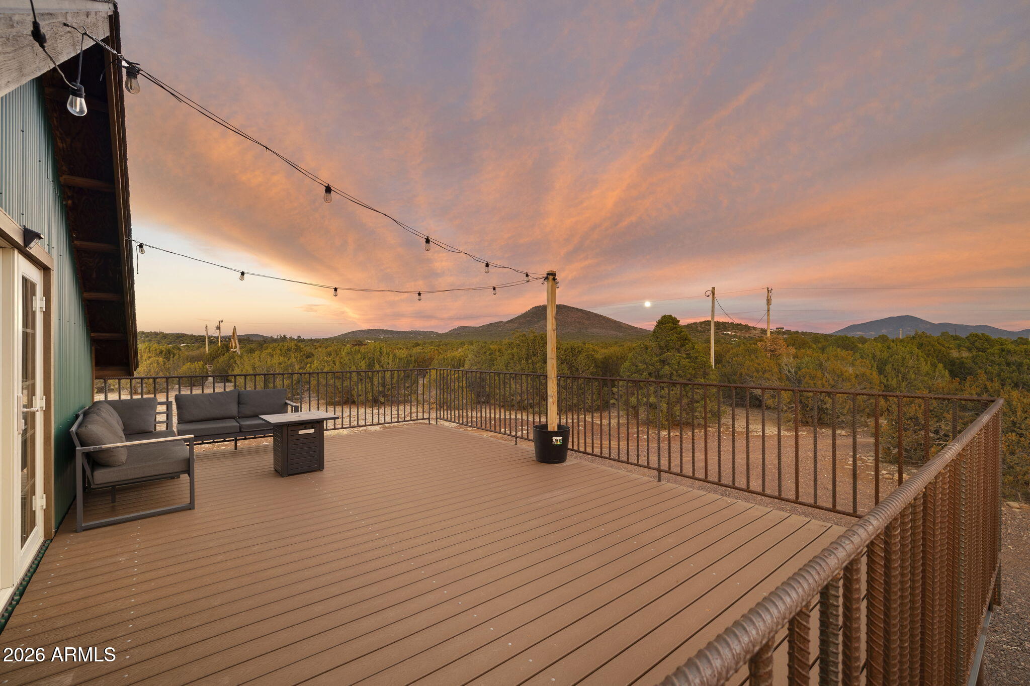 9042 North Red Fox Lane Williams, AZ 86046 - Photo 39 of 56 a view of roof deck with couches and wooden floor