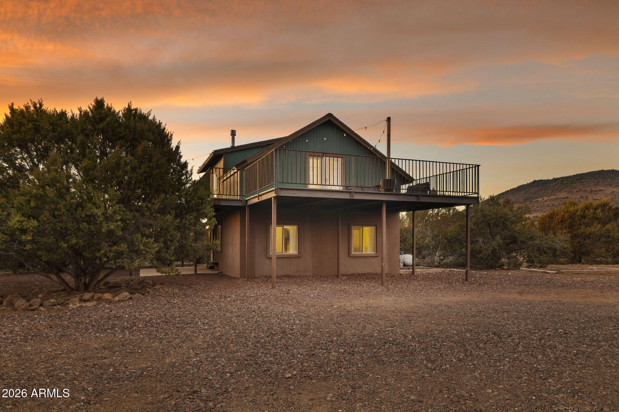 9042 North Red Fox Lane Williams, AZ 86046 - Photo 4 of 56 a front view of a house with a yard