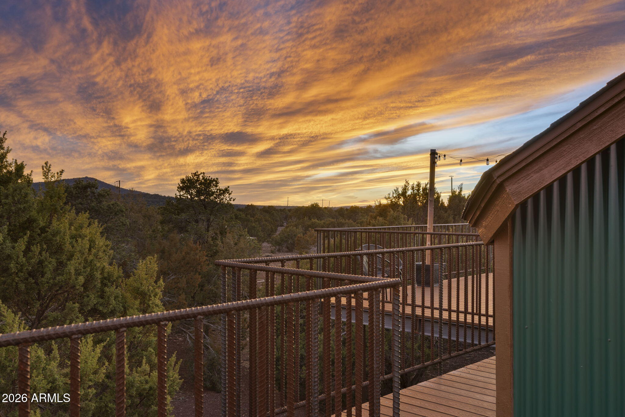 9042 North Red Fox Lane Williams, AZ 86046 - Photo 41 of 56 a view of a balcony with a forest