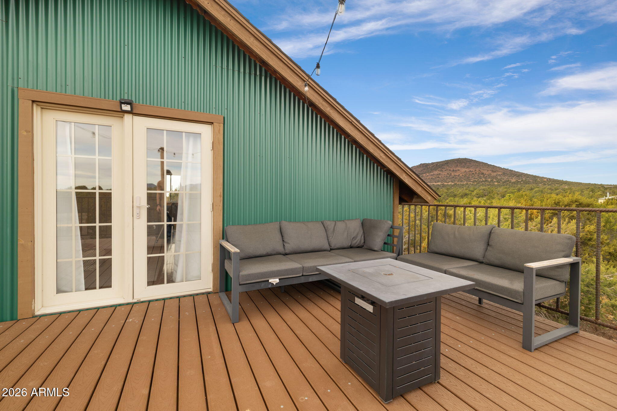 9042 North Red Fox Lane Williams, AZ 86046 - Photo 45 of 56 a terrace of a house with wooden floor and outdoor seating