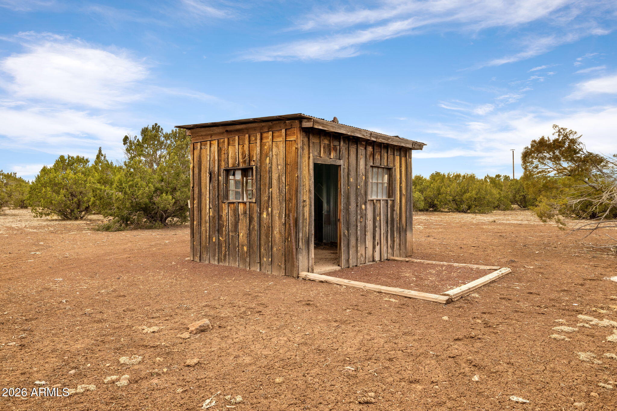 9042 North Red Fox Lane Williams, AZ 86046 - Photo 52 of 56 a view of a house with a backyard