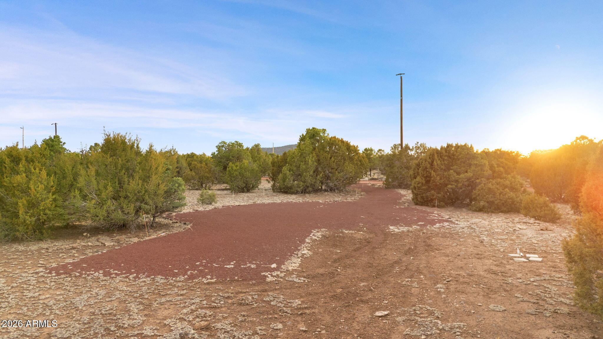 9042 North Red Fox Lane Williams, AZ 86046 - Photo 54 of 56 a view of a road with a building in the background