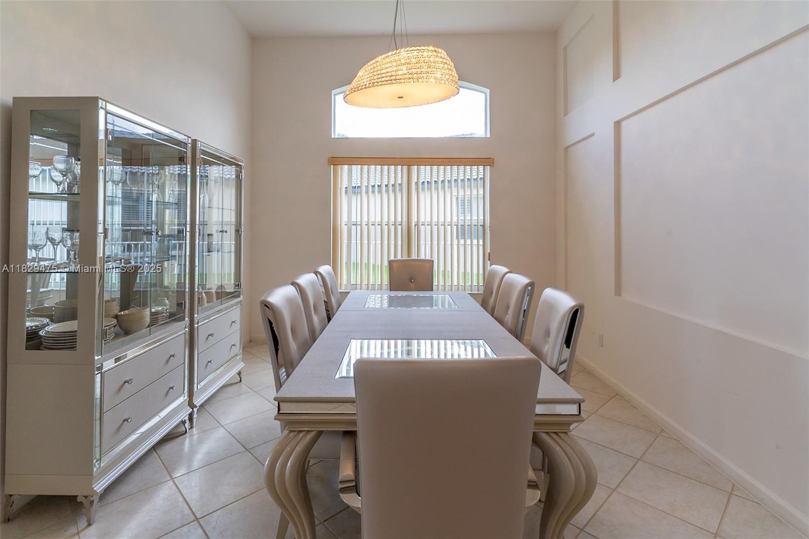 17999 Southwest 35th Street Miramar, FL 33029 - Photo 7 of 14 a view of a dining room with furniture wooden floor and chandelier