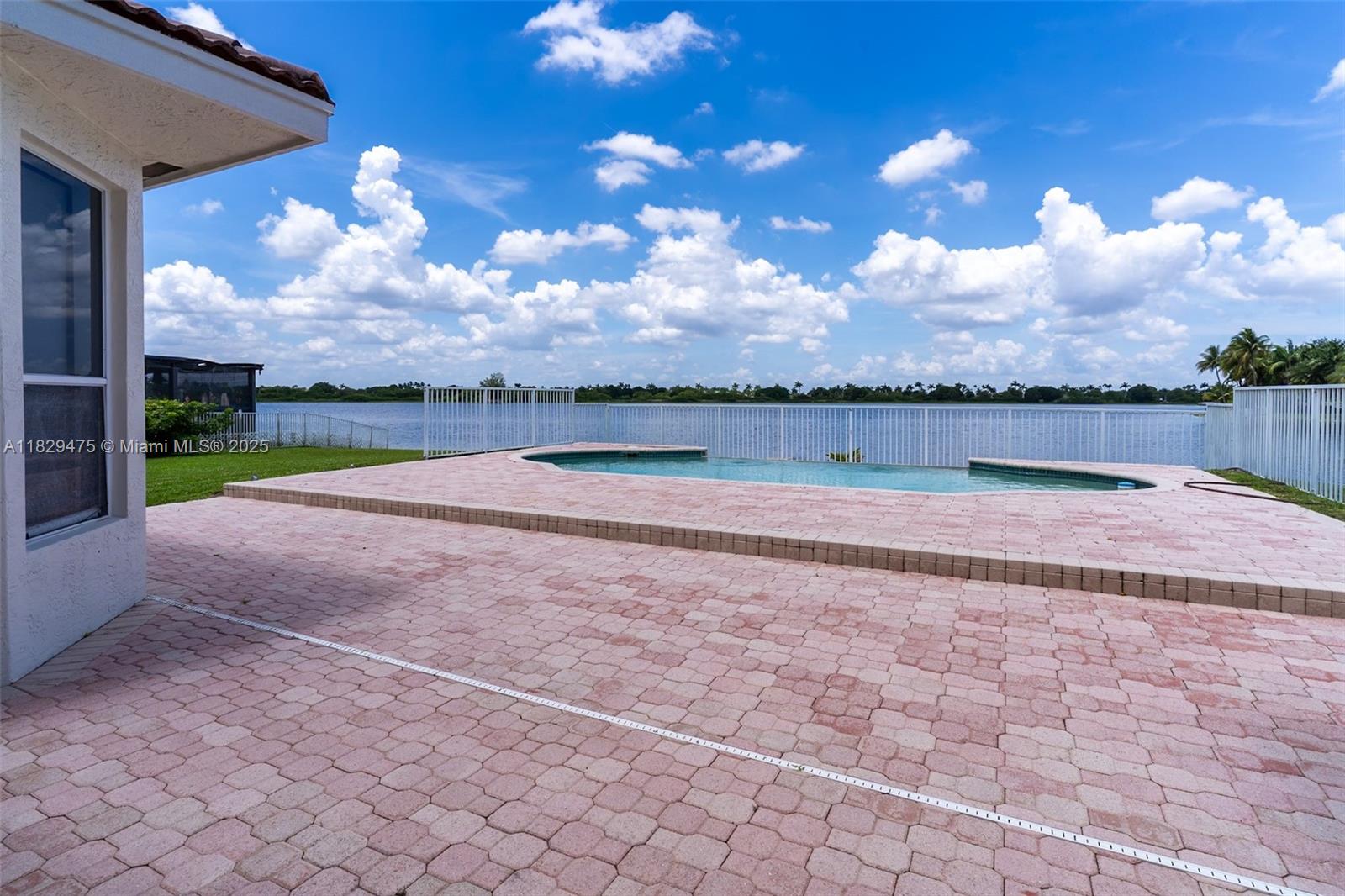 17999 Southwest 35th Street Miramar, FL 33029 - Photo 10 of 14 a view of swimming pool is middle in middle of the house