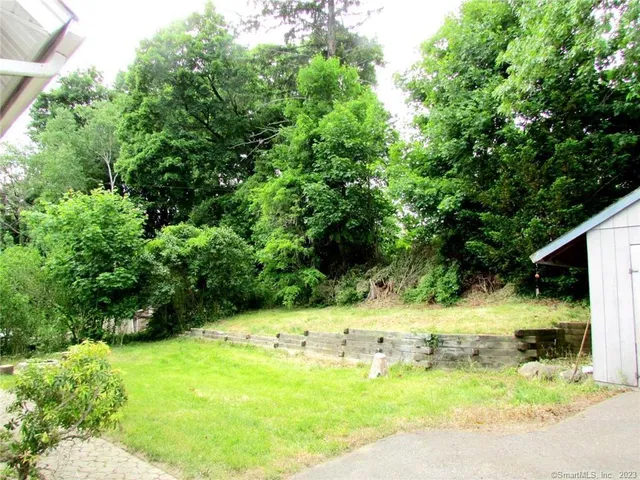 a view of a backyard of the house