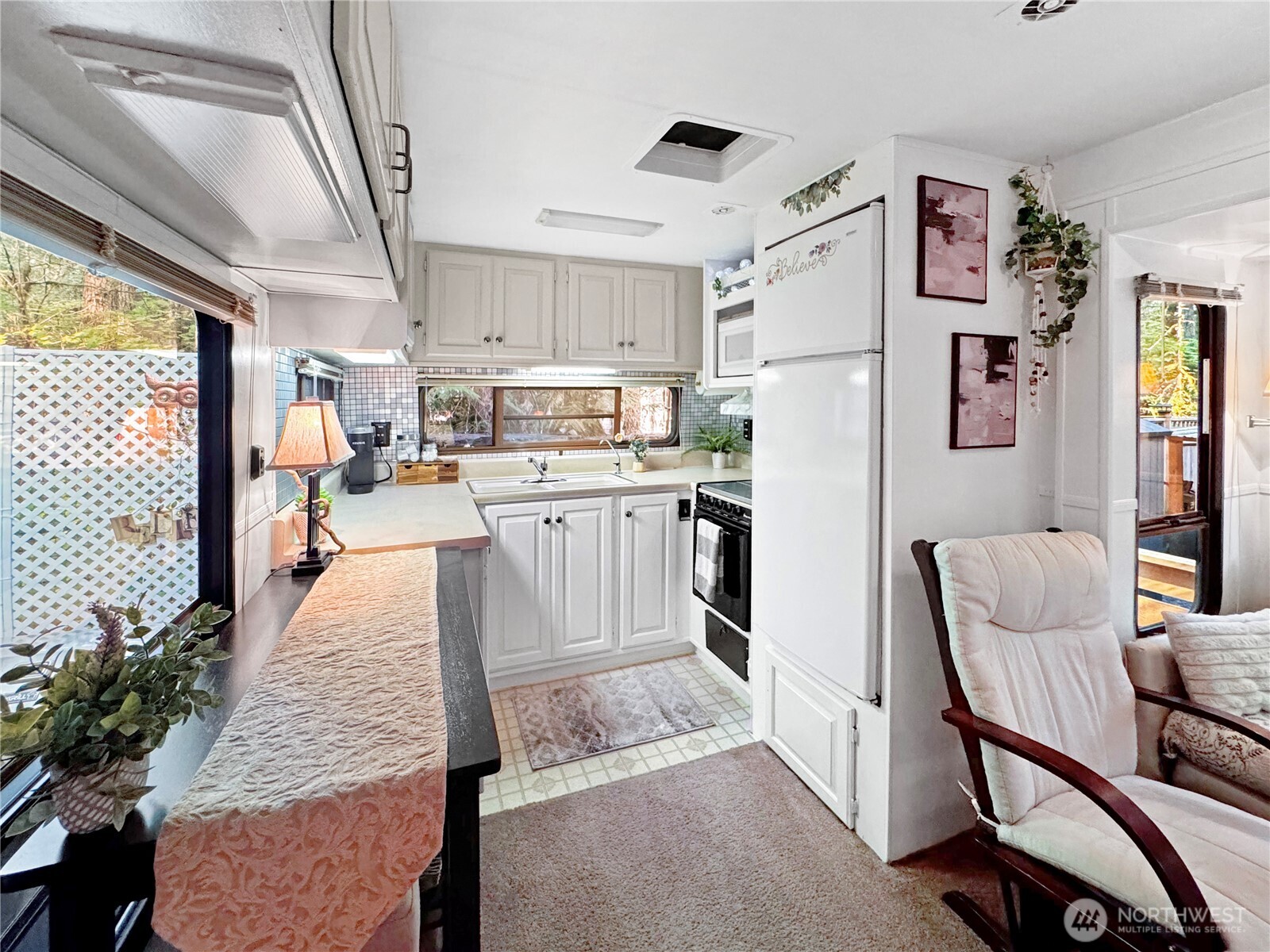 175-6 Chantrelle Drive Deming, WA 98244 - Photo 6 of 40 a living room with stainless steel appliances furniture a rug and a kitchen view