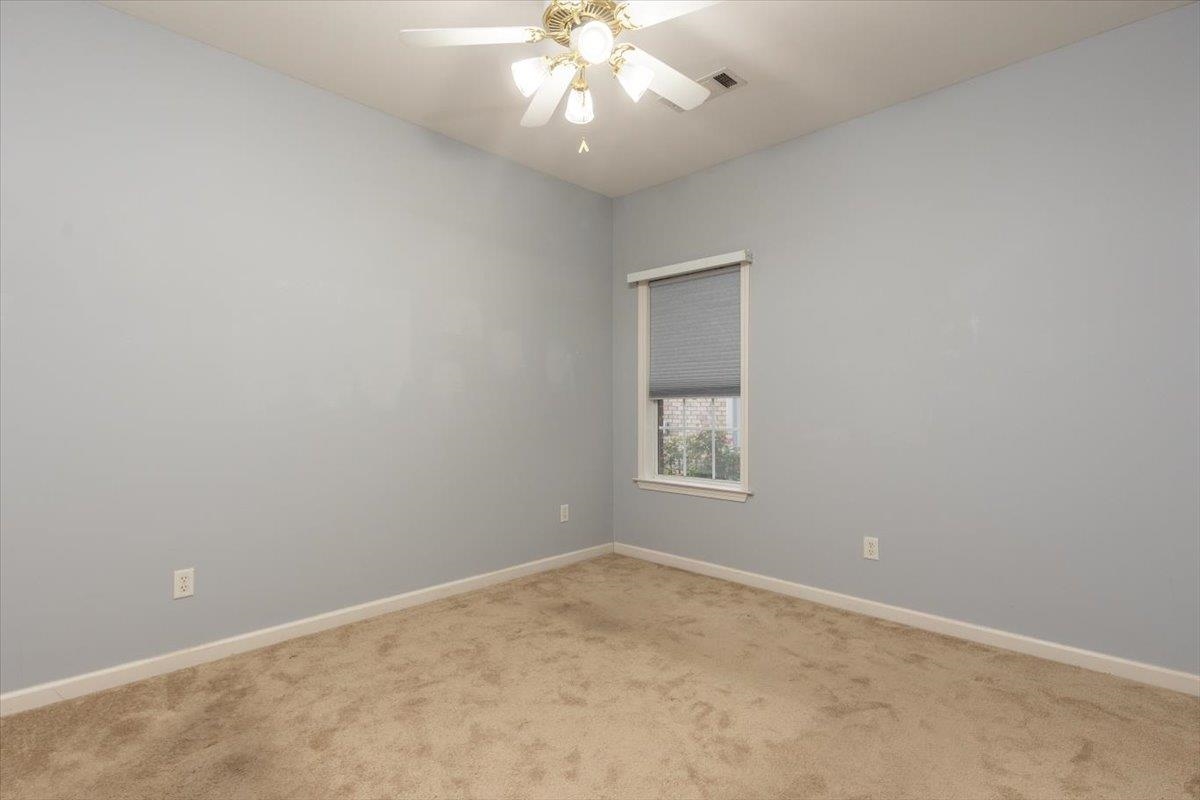 346 Beaver Road Munford, TN 38058 - Photo 17 of 24 Bedroom two with ceiling fan, light carpet, baseboards.