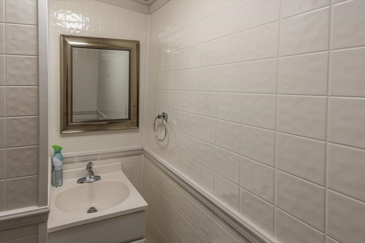 346 Beaver Road Munford, TN 38058 - Photo 22 of 24 Bathroom with tile walls and vanity