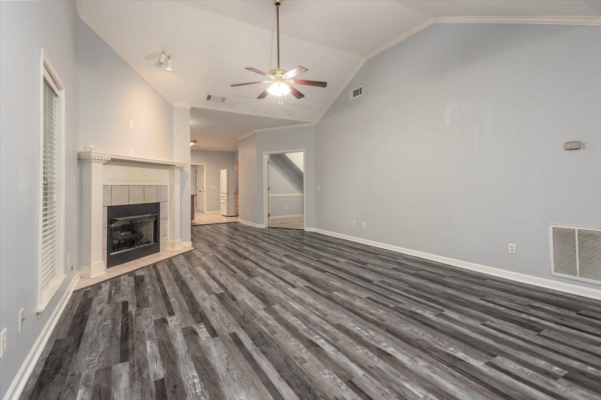 346 Beaver Road Munford, TN 38058 - Photo 6 of 24 Unfurnished living room with ceiling fan, dark wood-type flooring, and visible vents