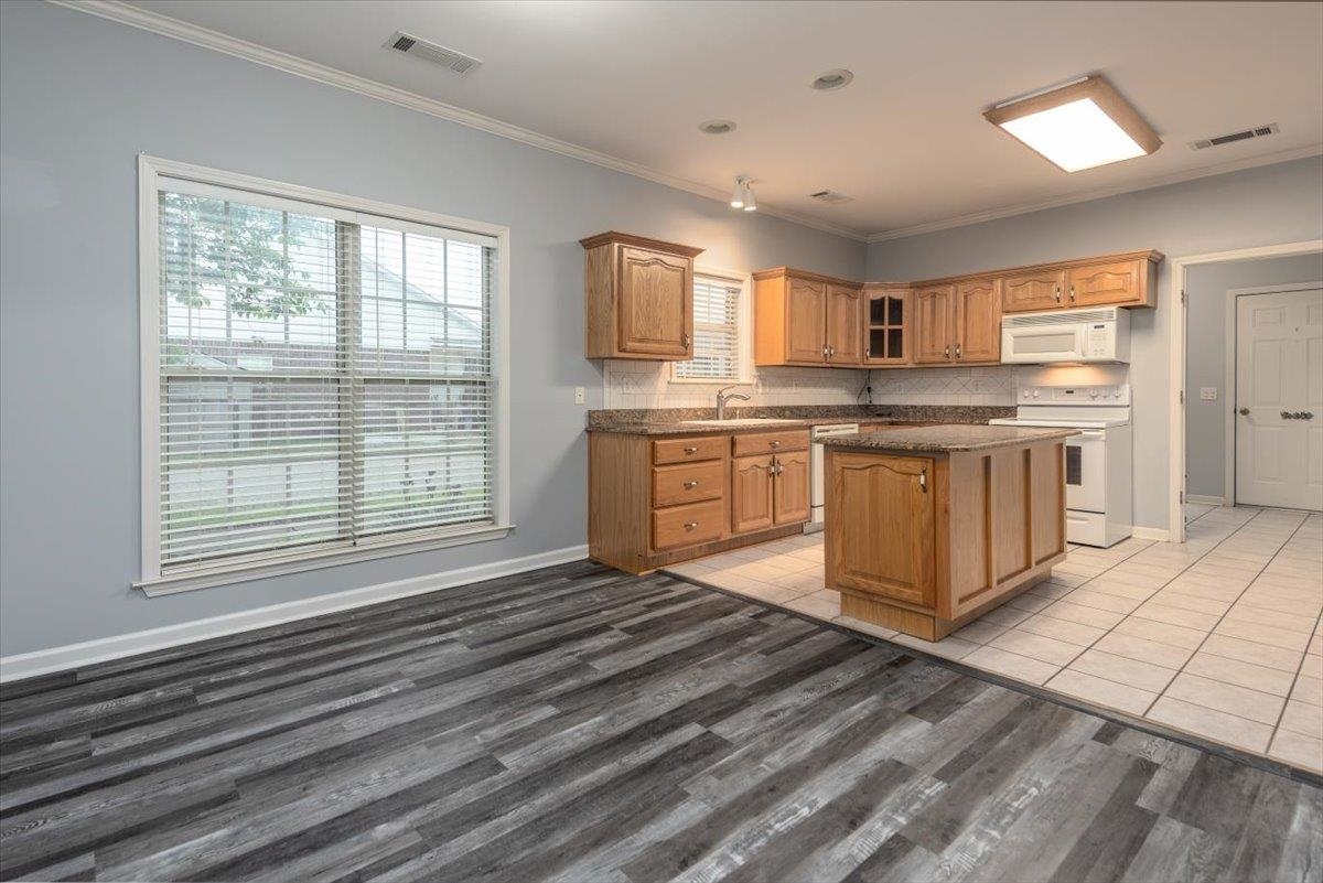 346 Beaver Road Munford, TN 38058 - Photo 7 of 24 Kitchen featuring a sink, white appliances, a center island, and visible vents