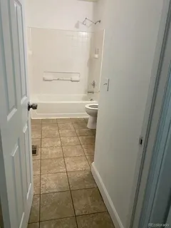 a bathroom with a glass door shower